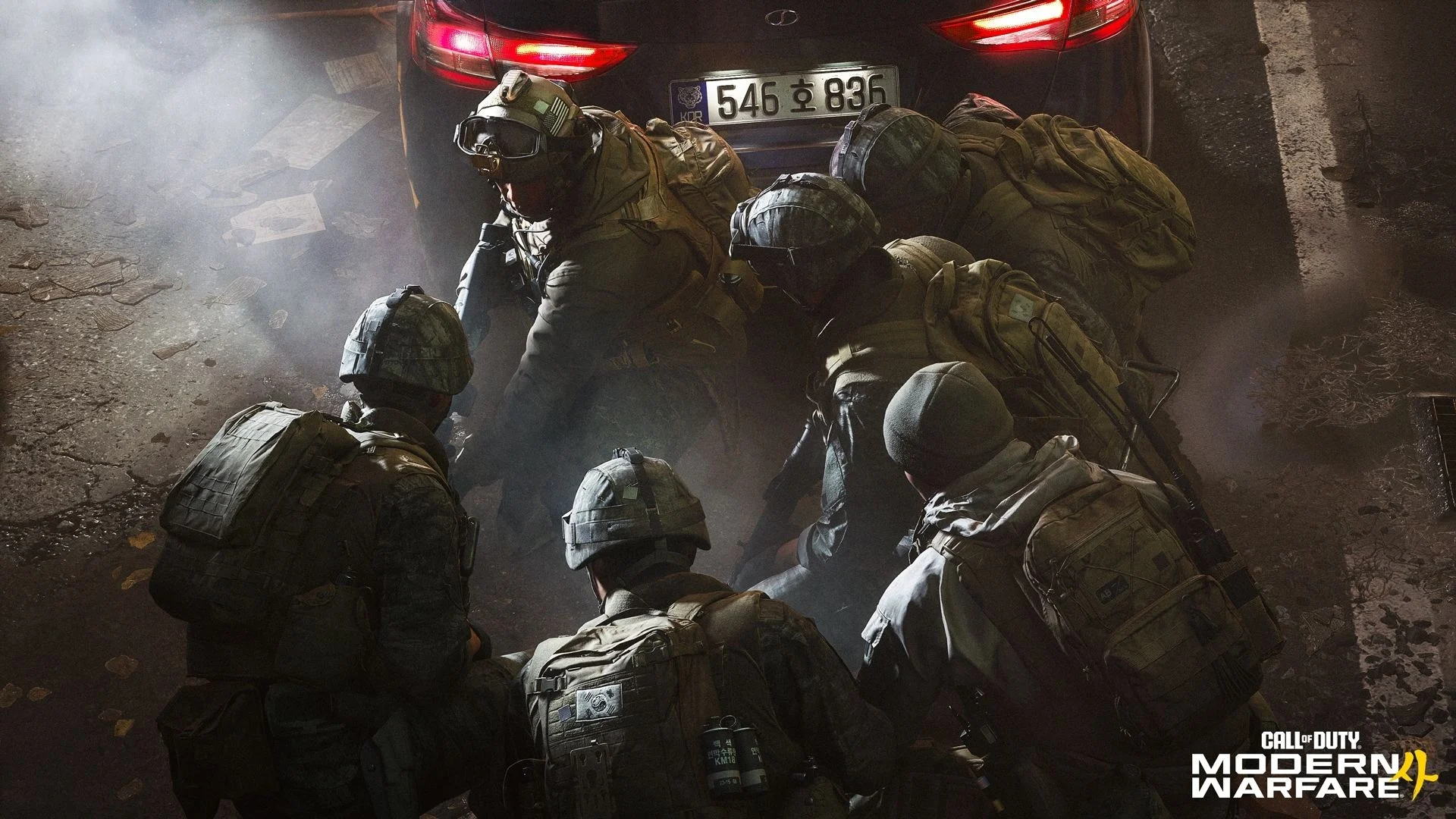 A Modern Warfare 4 military squad gathers behind a vehicle during a nighttime operation.