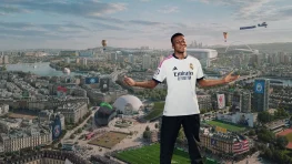 EA Sports FC 27 guide featuring a football star and Ultimate Team-inspired stadium cityscape