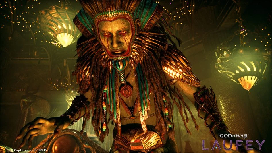 An armored figure reaches forward inside a glowing chamber in God of War Laufey.