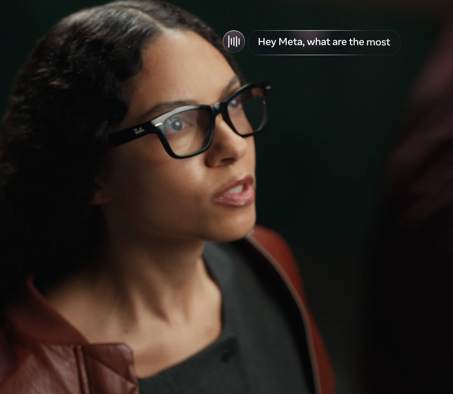 A person wearing black Ray-Ban Meta Audio glasses and speaking to Meta AI