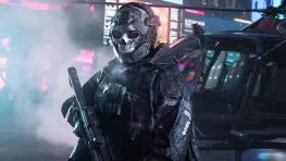 Modern Warfare 4 Kill Block Launches With 500+ Map Configurations 2 A masked Modern Warfare 4 Operator holding a rifle beside a military vehicle on the Kill Block map.