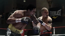 Two boxers exchange punches in EA Sports Fight Night gameplay.